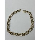 A 9ct gold link bracelet measures 19cm and weighs 9.35 grammes