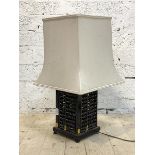 A modern Chinese table lamp, the base formed of four abacus, on ogee bracket supports, H54cm to