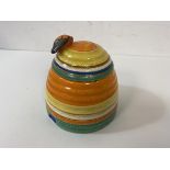 A Clarice Cliff Fantasque pattern honey pot, chip to rim of pot, measures 9cm high