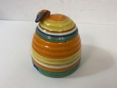 A Clarice Cliff Fantasque pattern honey pot, chip to rim of pot, measures 9cm high