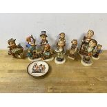 A collection of Hummel figures, tallest measures 15cm high, and a decorative plate (12)