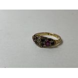 An 1899 Birmingham 15ct gold gem set ring with seed pearls, emeralds and spinel's, size Q, weighs