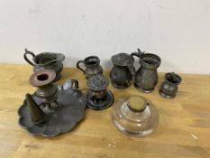 A quantity of pewter including measures, milk jug, chamber stick which measures 10cm high a/f,