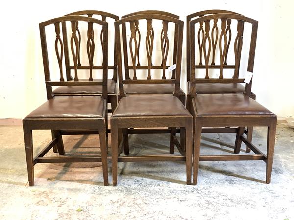 A Set of six Georgian style stained beech dining chairs, with pierced rail backs over drop in