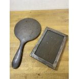 A Birmingham silver backed handmirror measures 26cm and a silver photo frame (2)