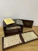 A 1920's / 30's early plastic tile mahjong set, drawers marked Chad Valley, measures 16cm x 23cm x