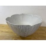 A mid 20thc Rye Pottery large bowl with black and white linear design with scalloped edge of