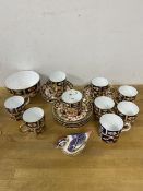 A set of nine Royal Crown Derby demi-tasse cups and saucers, one cup mis-matched, 5cm high, sugar