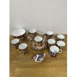 A set of nine Royal Crown Derby demi-tasse cups and saucers, one cup mis-matched, 5cm high, sugar