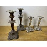 Two pairs of silver plated candlesticks, larger measures 26cm high