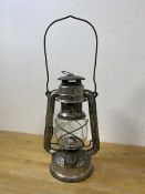 A German oil lantern inscribed Western Germany Baby Feuer Hand, glass marked Jena Glass, measures