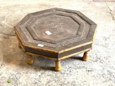 An eastern hardwood octagonal low table, the hammered copper top over painted turned supports,