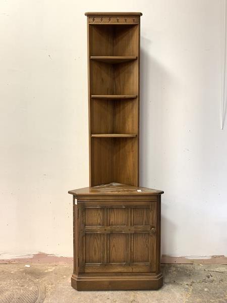 Ercol, A stained elm corner cabinet, with three open shelves over cupboard to base, H196cm, W68cm,