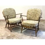 Ercol, A pair of stained beech framed model 203 easy chairs, H77cm, W70cm, D70cm