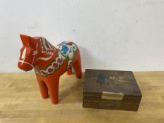 A Nils Olsson Swedish painted horse measures 20cm high along with a Scandinavian box (2)