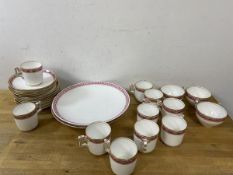 A set of ten demi-tasse coffee cups measure 6.5cm high along with eleven saucers, three other coffee