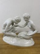 A china figure of gentleman kissing woman's hand marked Wien to base measures 28cm high