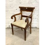 A 19th century walnut elbow chair, with reeded scrolled open arms, drop in upholstered seat pad,