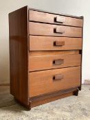 A mid century teak chest, fitted with five graduated drawers, H102cm, W82cm, D45cm