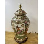 A 19thc famille rose lidded baluster shaped vase later converted to table lamp on wooden base,