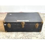An early to mid 20th century steamer trunk, with leather carry handle to each end, H34cm, W93cm,