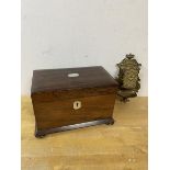 A 19thc rosewood tea caddy with mother of pearl inlay lacking one canister lid on squat bun feet