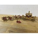 A cast metal coronation carriage and eight horses toy stamped Johill & Co to base, measures 33cm