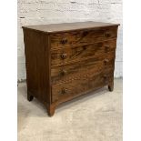 An early to mid 19th century mahogany chest, the top with checkered inlay to front edge over four
