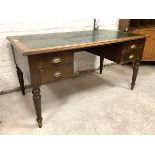 A Victorian oak and stained pine knee hole desk, the top with inset skiver, over four drawers,