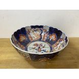 An Imari bowl with scalloped edge, repairs, measures 13cm x 31cm