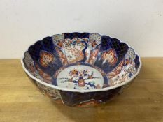 An Imari bowl with scalloped edge, repairs, measures 13cm x 31cm