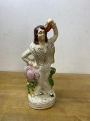A 19thc Staffordshire figure of dancing man, measures 22cm high