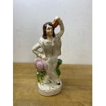 A 19thc Staffordshire figure of dancing man, measures 22cm high