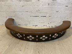 An unusual early 20thc low crescent shaped style stool fire fender with padded leather top on