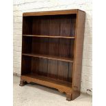 Fyne Ladye, A mid 20th century mahogany floor standing open bookcase, moulded top over two open