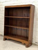 Fyne Ladye, A mid 20th century mahogany floor standing open bookcase, moulded top over two open
