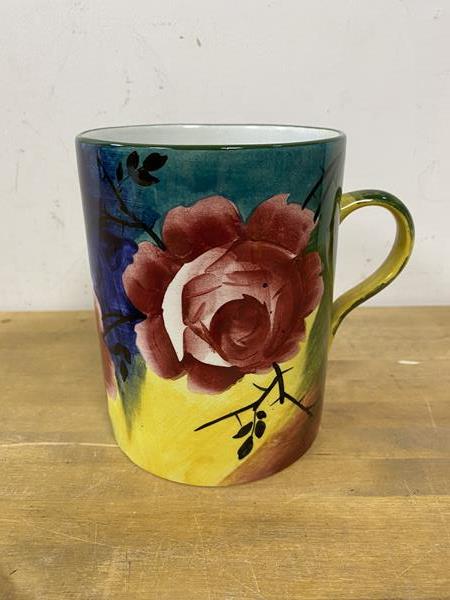 A Weymss large mug with polychrome ground and rose decoration measures 14cm high