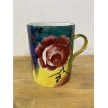 A Weymss large mug with polychrome ground and rose decoration measures 14cm high