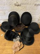 A collection of hats including top hat, bowlers, fur hat, also a collection of bow ties, clip on bow