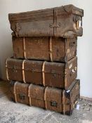 A group of three steamer trunks, together with an early 20th century leather holdall (Largest