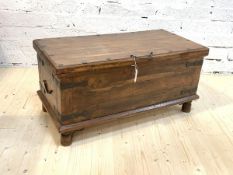 A late 20th century hardwood blanket box, the hinged and studded top over iron bound body, raised on