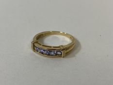 A 9ct gold ring with five amethyst stones size R weighs 2.76 grammes