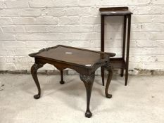 A George II style mahogany low table, with serpentine top over shell carved cabriole supports (