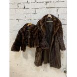 A fur coat measures 35cm across shoulders x 100cm and another fur jacket (2)