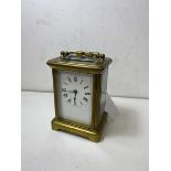 A late 19thc carriage clock with 4 glass roman numerals to dial, measures (with handle) 15cm high