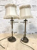 A pair of table lamps with ruffled shades, on straight supports with circular base, H54cm to top