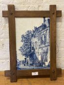 A tile wall art comprised of six tiles depicting city scene with figures in oak frame, measures 43cm