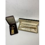 An Anson three hundred and sixty gold plated pen, measures 12.5cm, in original box along with a gold
