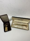 An Anson three hundred and sixty gold plated pen, measures 12.5cm, in original box along with a gold