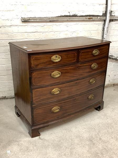 A Georgian mahogany bowfront chest, circa 1800, the moulded top over two short and three long